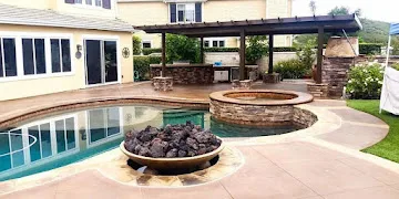 Stamped concrete around a backyard firepit