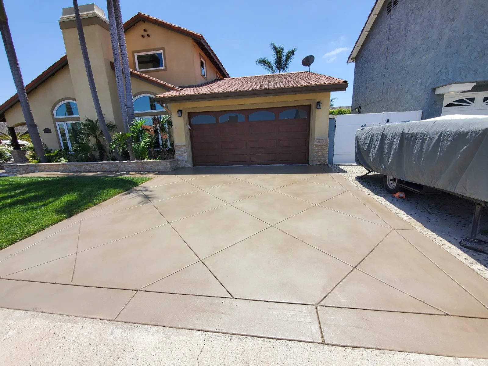 Curved stained concrete patio restored for a Foothill Ranch home