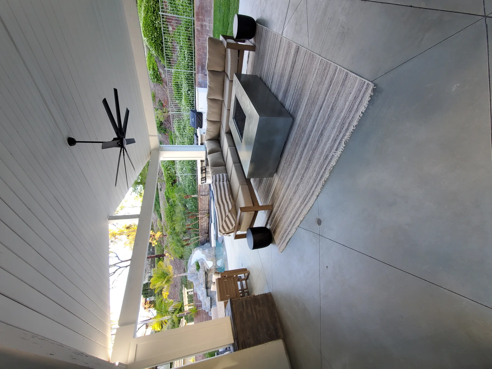 Repaired and stained concrete patio side yard