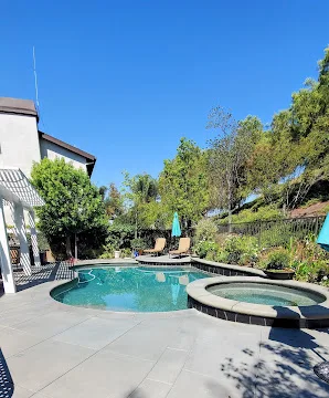 Refinished pool deck concrete with a clean even surface