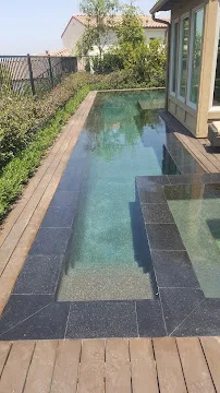 Concrete surface being prepared for treatment and sealing